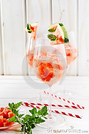 Cubed watermelon, fresh mint and straws Stock Photo