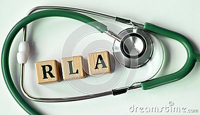 Cubes with the abbreviation RLA on the background of a stethoscope Stock Photo