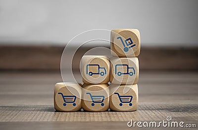 Cubes, blocks or Dice with online shopping symbols on wooden background Stock Photo