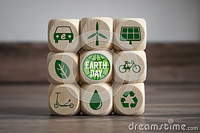 Cubes and dice with Earth Day with green electricity icons Stock Photo