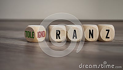 Cubes and dice with german words for tolerance and ignorance - toleranz und ignoranz on wooden background Stock Photo