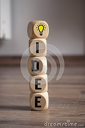 Cubes dice with inspiration concept light bulb metaphor for good idea Stock Photo