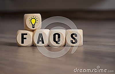 Cubes dice with light bulb and faqs Stock Photo