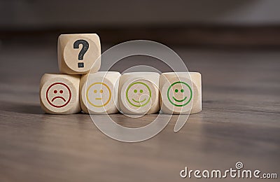 Cubes, dice and paper work with rating emoticons Stock Photo