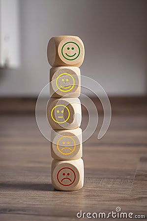 Cubes, dice and paper work with rating emoticons Stock Photo