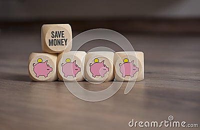 Cubes dice with piggy banks and save money Stock Photo