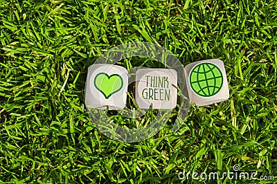 Cubes and dice with think green and save our planet with green electricity Stock Photo