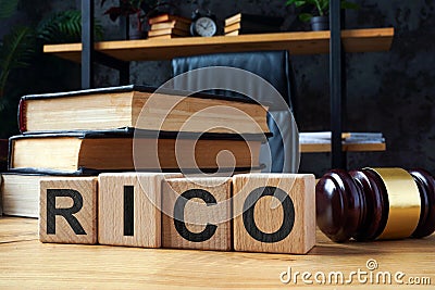 Cubes with letters RICO Racketeer Influenced and Corrupt Organizations Act and gavel. Stock Photo