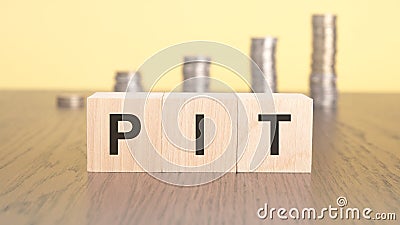 cubes with the word PIT on them. tax concept Stock Photo