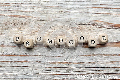 Cubes with words Promo Code on white wooden table, flat lay Stock Photo