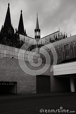 Cubist architecture of the Roman-Germanic Museum in front of Cologne Cathedral in Cologne, Germany Stock Photo