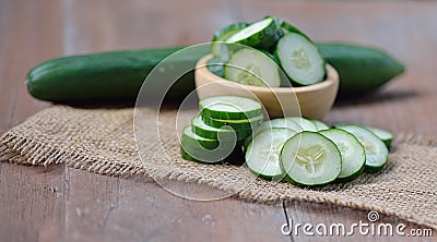 Cucumber isolated on wooden background Stock Photo