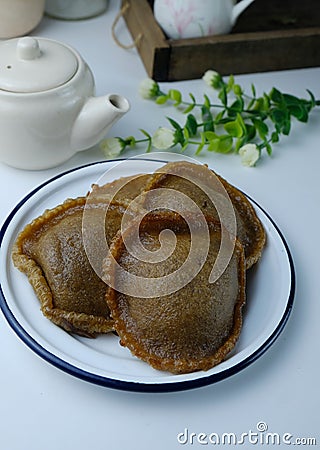 Cucur Jawa or kuih cucur Malay traditional on white plate Stock Photo