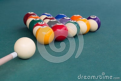 Cue aiming white ball to break snooker billards on table Stock Photo