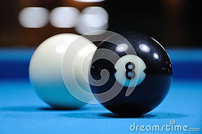 Cue and Black Eight Balls Stock Photo