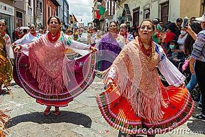 Elderly female folk dancers represent the culture of the Cayambe, Ecuador Editorial Stock Photo