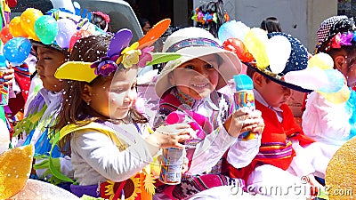 Little girls dressed in carnival costumes with cans of spray Editorial Stock Photo
