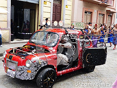 Vintage car covered with foam, carnival in Ecuador Editorial Stock Photo