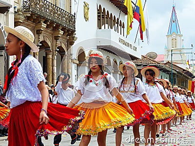 Cuenca, Ecuador. Group of girls dancers dressed in colorful costumes as cuencanas at the parade Editorial Stock Photo