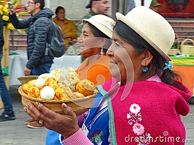 Village woman carries a bowl with bolons, Ecuador Editorial Stock Photo