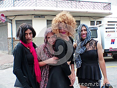 Cuenca, Ecuador. Young guys dressed as `black widow` asking for money at the streets Editorial Stock Photo