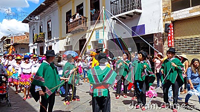 Cuenca, Ecuador. Dancers with ribbons during a parade Paseo del Nino Viajero Editorial Stock Photo