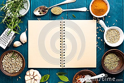 Culinary background and recipe book with spices on wooden table Stock Photo