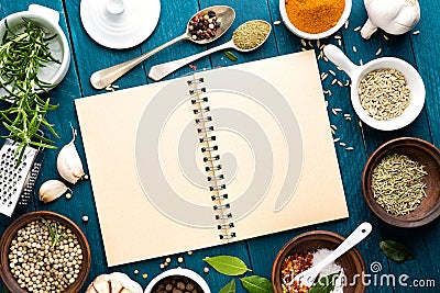 Culinary background and recipe book with spices on wooden table Stock Photo