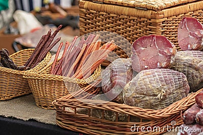 Culinary buffet with a presentation of a variety of healthy dishes - meat, various sausages, boiled pork, smoked meats. Stock Photo