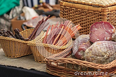 Culinary buffet with a presentation of a variety of healthy dishes - meat, various sausages, boiled pork, smoked meats. Stock Photo