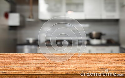 Culinary Elegance: Wooden Board Empty Table Background with Blurred Kitchen Ambiance Stock Photo