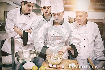 Culinary students learning how to mix dough Stock Photo