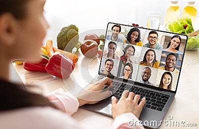 Culinary Workshop. Nutritionist Female Having Web Conference With Group Of Young People Stock Photo