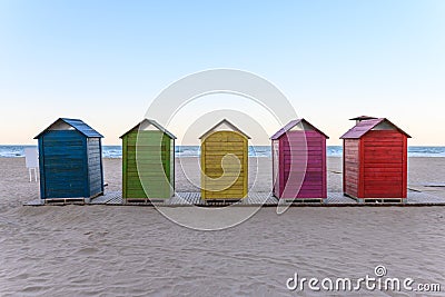 Beach huts on the beach Stock Photo