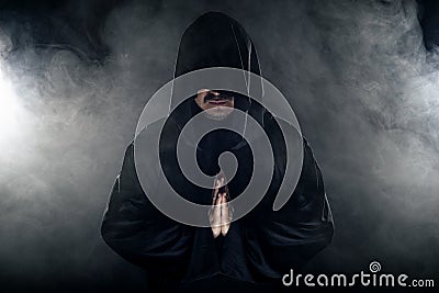 Cult Leader in a Black Robe Stock Photo