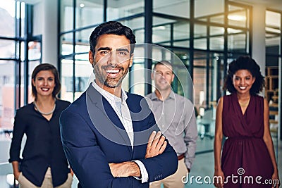 Cultivating a team of confident and competent individuals. Portrait of a team of confident professionals standing Stock Photo