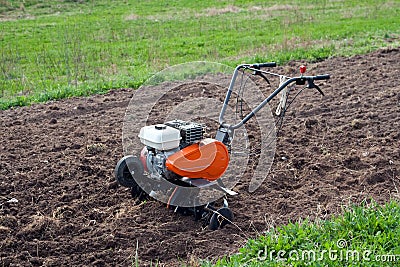 Cultivator on field. Stock Photo