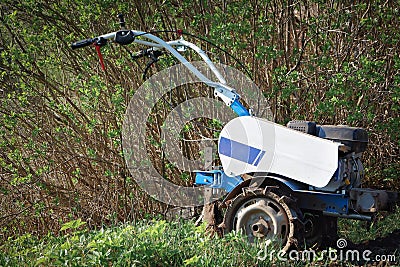 The cultivator for soil cultivation. Plow the land Stock Photo