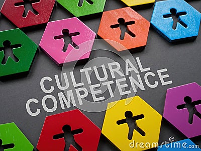 Cultural competence sign and small colorful figurines. Stock Photo