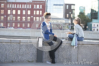 Cultural diversity in Moscowy - couples walking the waterfront p Editorial Stock Photo