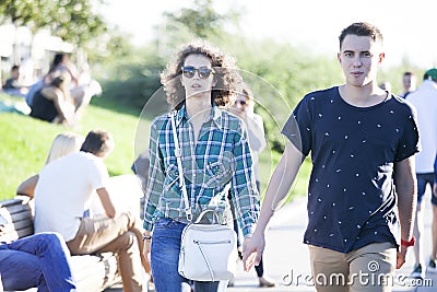 Cultural diversity in Moscowy - couples walking the waterfront p Editorial Stock Photo