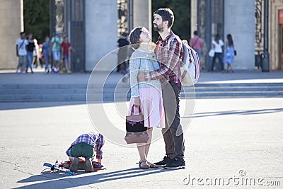 Cultural diversity in Moscowy - couples walking the waterfront p Editorial Stock Photo