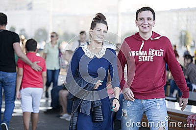 Cultural diversity in Moscowy - couples walking the waterfront p Editorial Stock Photo