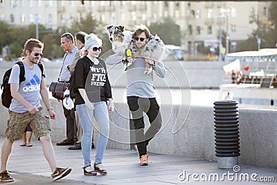 Cultural diversity in Moscowy - couples walking the waterfront p Editorial Stock Photo