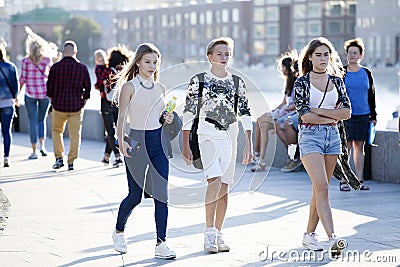 Cultural diversity in Moscowy - teens walking the waterfront pro Editorial Stock Photo