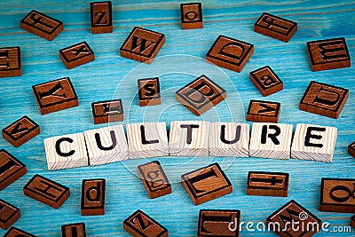 Culture word written on wood block. Wooden alphabet on a blue background Stock Photo