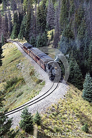 Cumbres and Toltec steam engine historic train chugging slowly up the mountain pass towards Antonito, Colorado Editorial Stock Photo