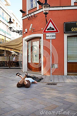 Cumil - statue of Man at work in Bratislava, Slovakia Editorial Stock Photo