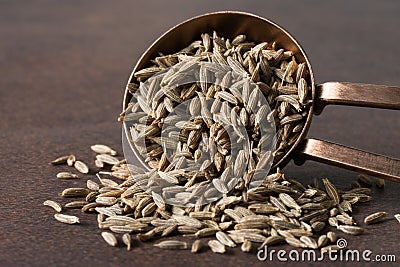 Cumin Seeds Spilled from a Teaspoon Stock Photo