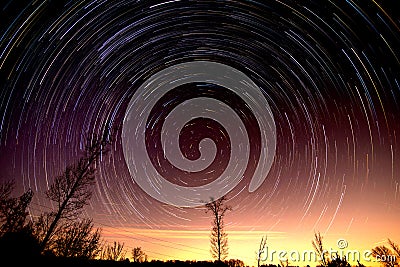 Cumulative time lapse of star trails in night sky Stock Photo